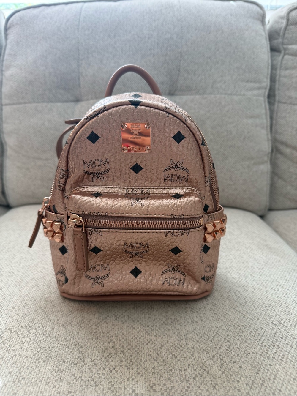 MCM Metallic Rose Gold Mini Backpack with Stud Accents